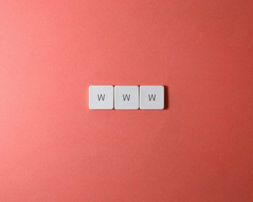 Close-Up Shot of Keys on a Red Surface